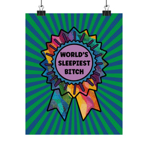 A vertical poster print featuring a colorful ribbon award badge with the text 'WORLD'S SLEIPEST BITCH' in black on a pink circle. The background of the poster has green and blue sunburst rays.