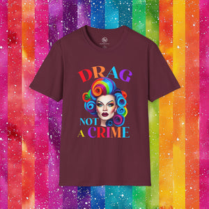 Maroon t-shirt with 'Drag Not A Crime' graphic on a colorful striped background