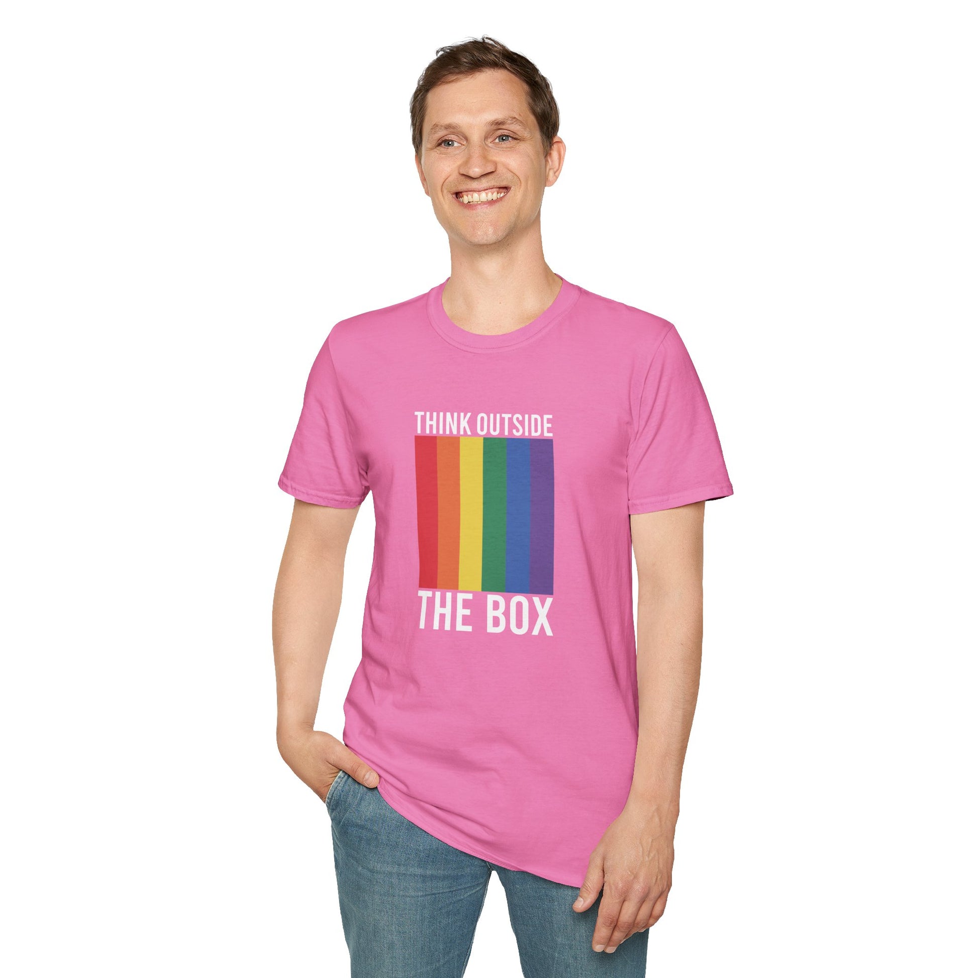 Person wearing a pink t-shirt with a rainbow design and text on a white background