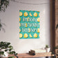 A vertical canvas wall art print featuring a teal background with yellow lemon illustrations and the text 'I'm doing my fucking best here' in white with a black outline. The canvas is displayed hanging on a textured off-white wall in a styled room setting with a wooden console table, potted plants, and string lights.
