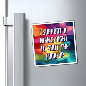 A square refrigerator magnet with a colorful watercolor background and bold white text reading 'I SUPPORT A MAN'S RIGHT TO SHUT THE FUCK UP' is shown attached to a silver stainless steel refrigerator door.