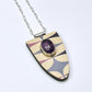 Purple Atomic Shield Pendant