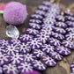 Cascading Sunburst Coin: Purple & White Painted Step Bone Beads, 16mm Charms