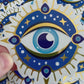 Bespattered Facade Metallic Gold and Blue Painting Evil Eye Sticker